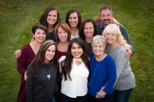 company group photo at Rolland Moore Park in Fort Collins