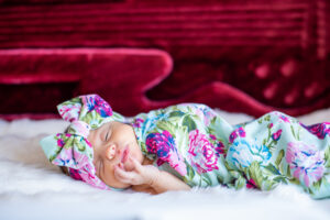 photo of new born in bass guitar case